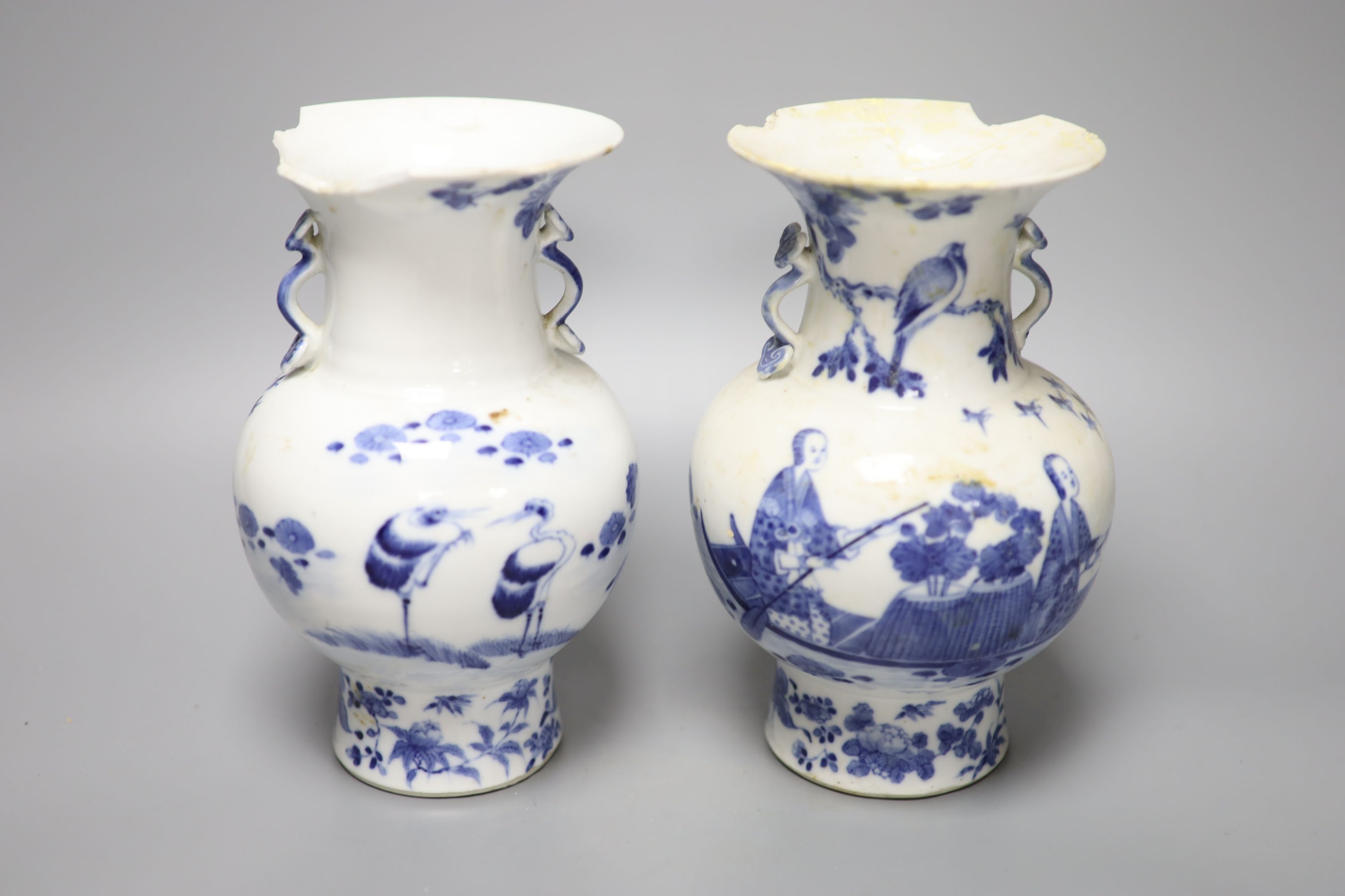 A pair of 19th century Chinese blue and white vases (a.f.), 23cm high